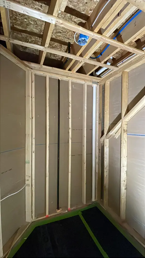 Wall framing with insulation before drywall