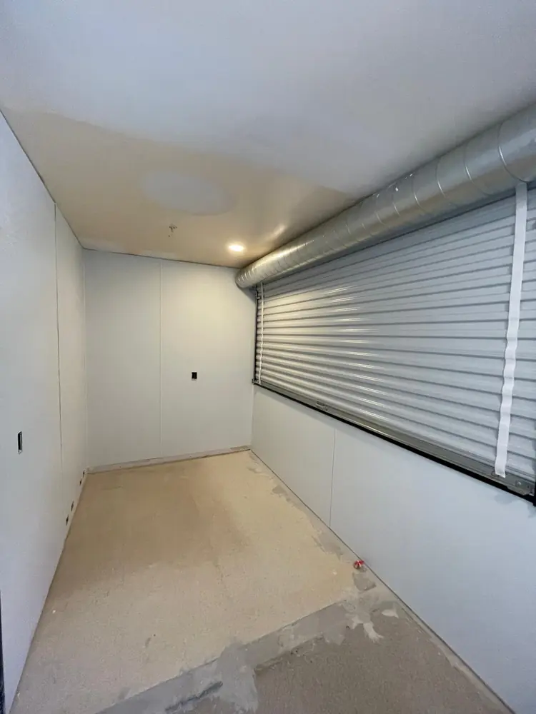 Garage with finished drywall walls